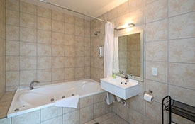 spa bath and shower in ensuite bathroom